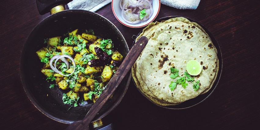 Enjoy North Indian cuisine with scenic views and ambience near Lakhamandal caves.