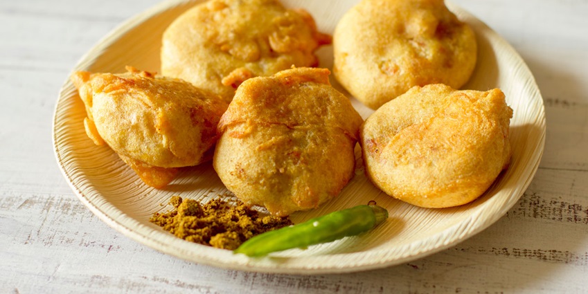 Image of delicious Mumbai Batata Vada served on a plate with chutney on the side