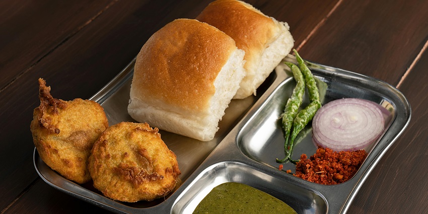 Image of Combination Plate with Maharstrian Food served on a steel plate