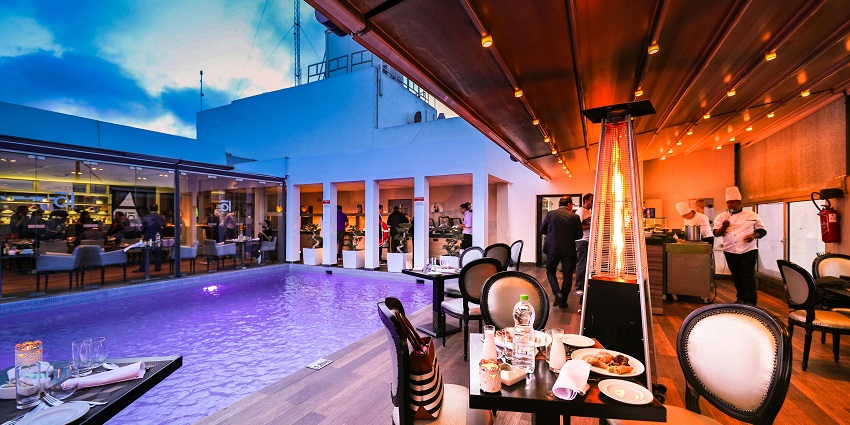 An image of a diverse dining scene near a water park in Lucknow featuring various cuisines.