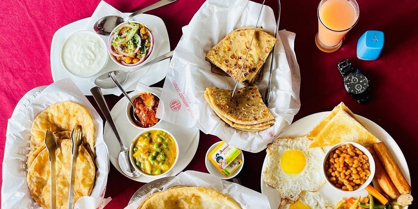 An image of a breakfast platter served at Hotel Central Plaza near Ramnabagan Sanctuary.