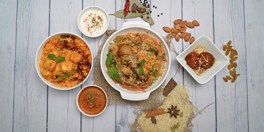 A table topped with bowls of food and sauces, offering a glimpse into the vibrant culinary scene.