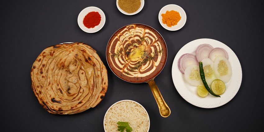 An image of a plate of freshly cooked Bengali food served near the monastery.