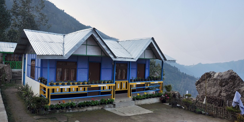A scenic view of lush greenery and hills near Bakreshwar Hot Spring in West Bengal.