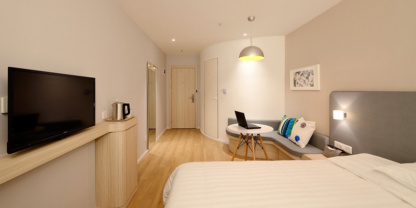Modern bedroom interior design with cosy decor, offering a comfortable and relaxing ambience.