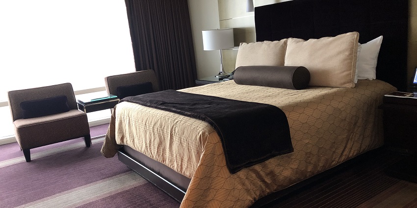 An image of a room with two beds for a comfortable stay near Badlands National Park.