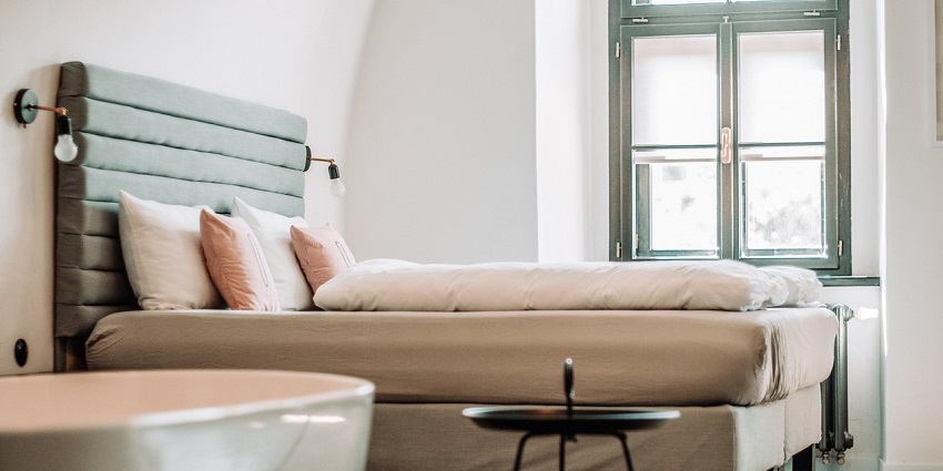 Elegant bedroom with stylish decor, soft lighting, and cosy ambience in a modern interior setting.