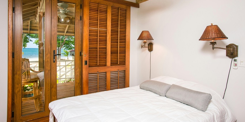 Image of a hotel room with scenic view from the balcony and windows and good amenities