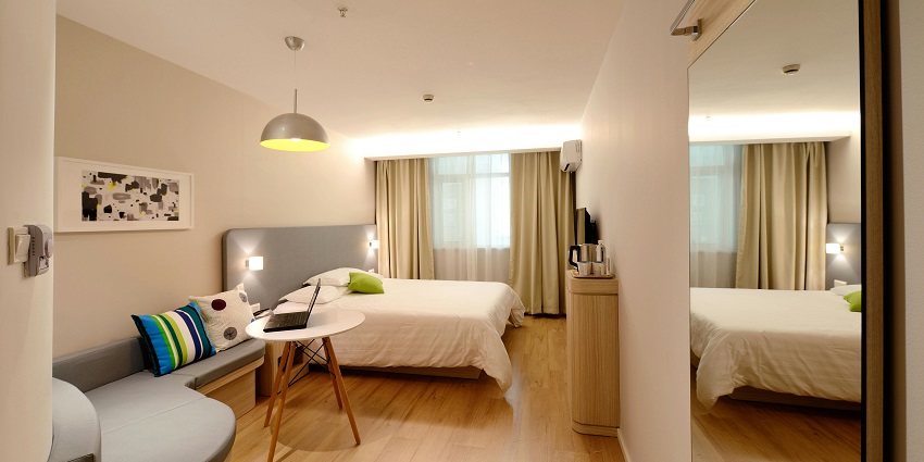 Picture of a bedroom interior with a bed, in a hotel near Sajnekhali Wildlife Sanctuary.
