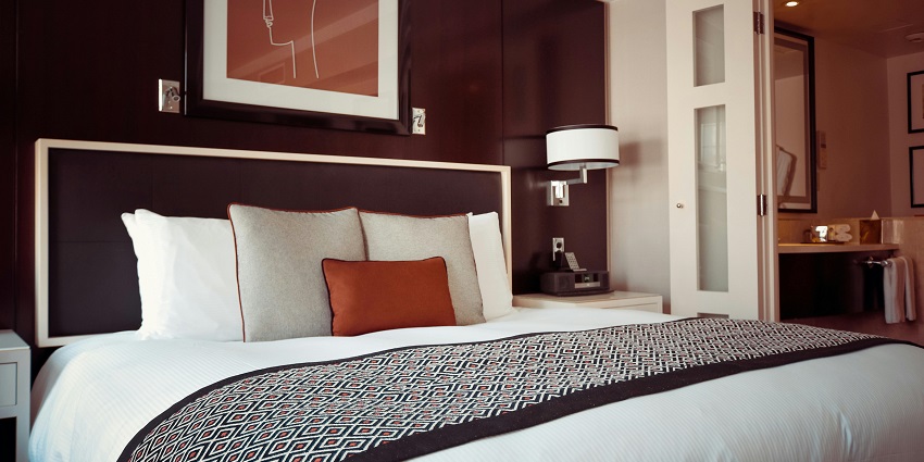 An image of comfortable hotel room offering cosy rooms and amenities