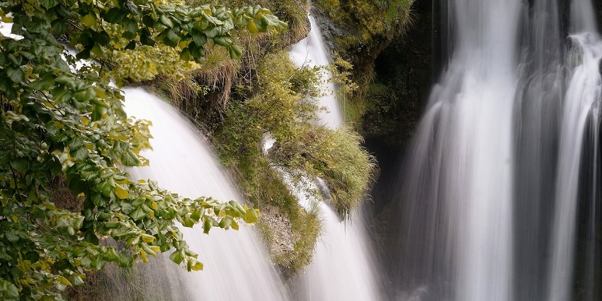 A picture of Whistle Khola Waterfalls in Mirik, a charming waterfall by a serene riverbank