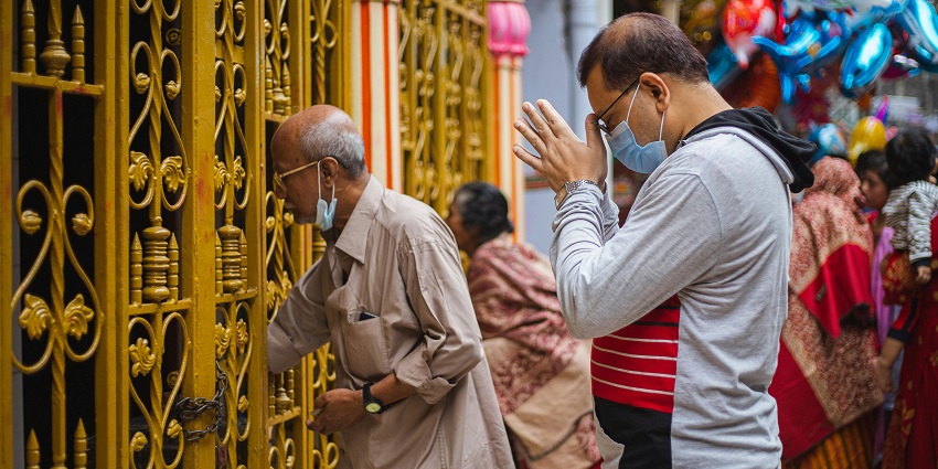 An image of the devotees worshipping the lord, showcasing a serene atmosphere.