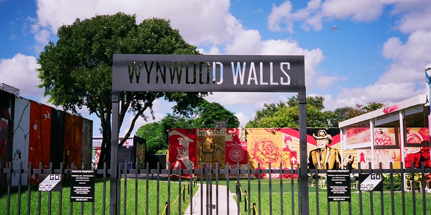 Wynwood Walls in Miami with an outdoor colourful street art museum on a sunny day.