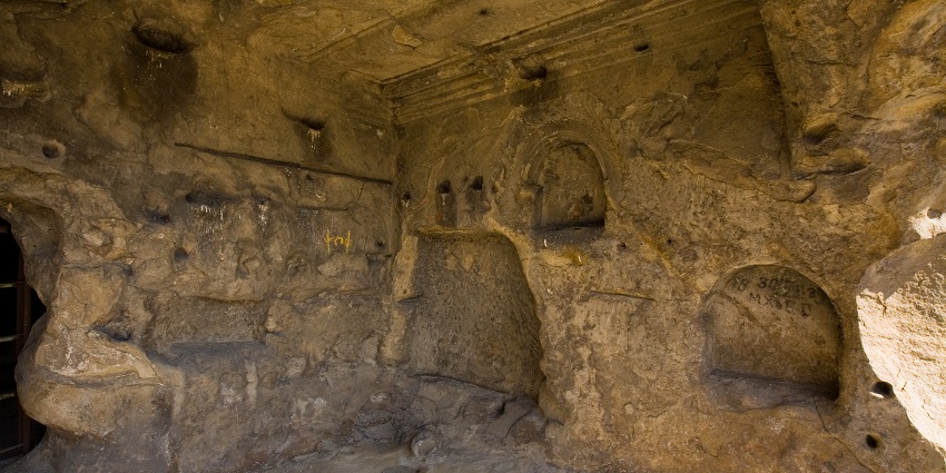 Secluded cave with natural rock formations and mysterious ambiance
