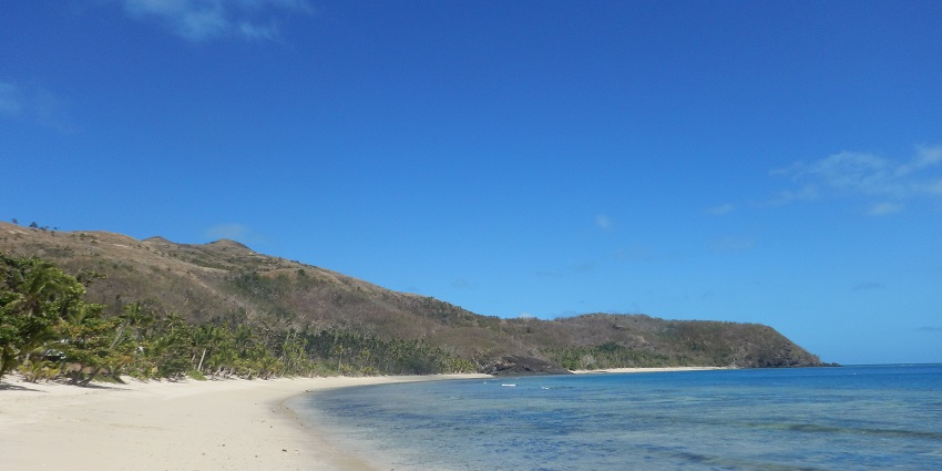 A view of a delightful sunrise over the ocean at one of the secluded beaches in Fiji.