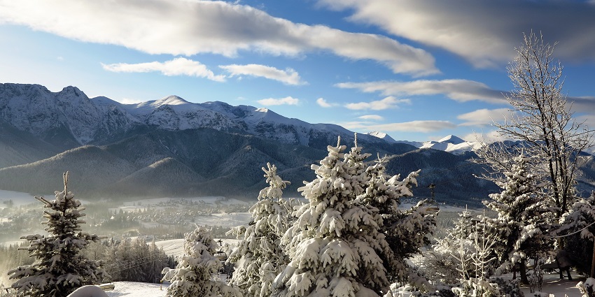 Zakopane Valley in winters covered in snow and mountains in the background of Poland