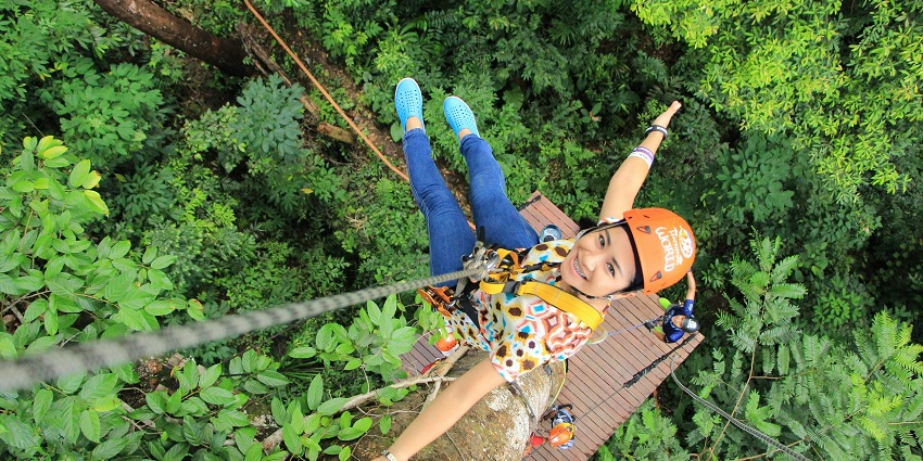 A person zip-lining through the air, one of the best adventure sports in Kolkata.