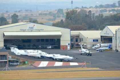 An aerial picture of an airport in South Africa with multiple aircrafts lined up