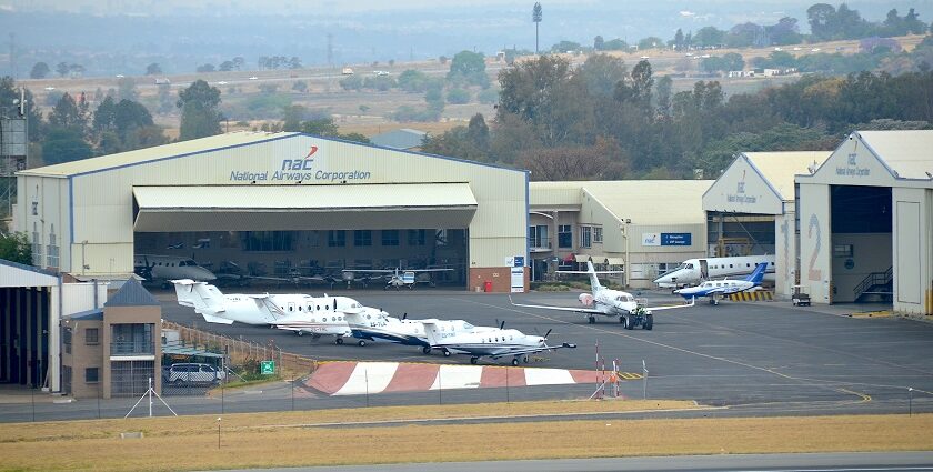 An aerial picture of an airport in South Africa with multiple aircrafts lined up