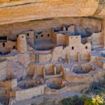 A breathtaking view of Mesa Verde National Park, featuring a rugged cliffside.