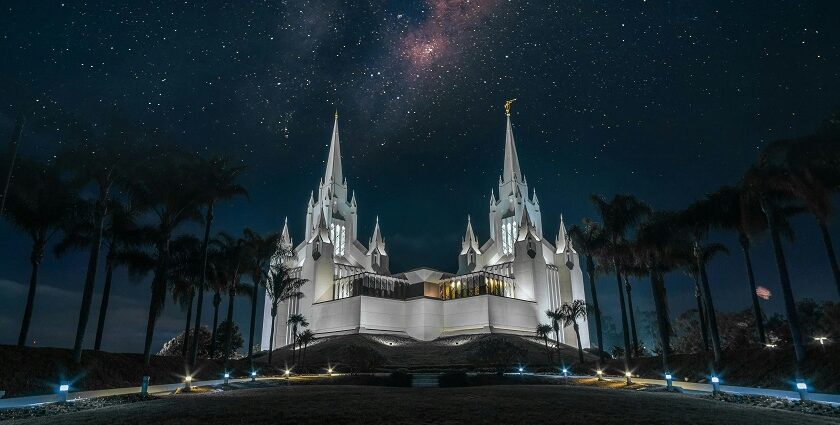 An image of one of the temples in California with tall spires against a clear sky.