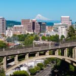 An aerial view of Portland shows snow-covered Mount Hood in the background, Oregon.