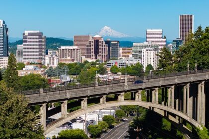 An aerial view of Portland shows snow-covered Mount Hood in the background, Oregon.