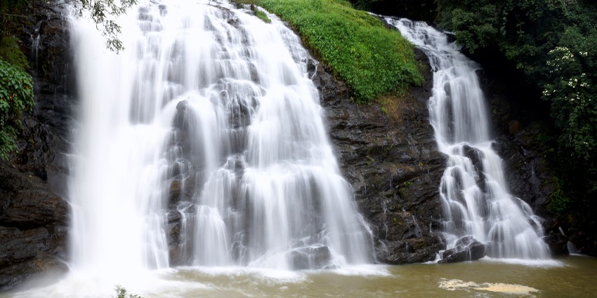 Milkish appearance of water at the beautiful Abbey Falls in Coorg, Karnataka.