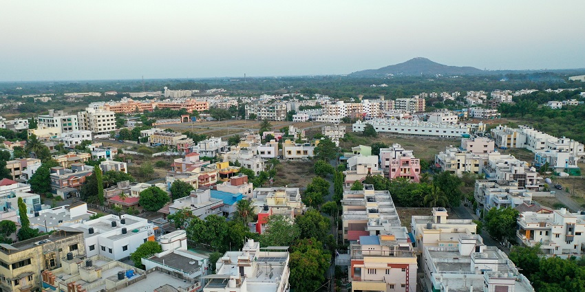 Image of Valsad, Gujarat surrounded by lush greenery under clear blue sky
