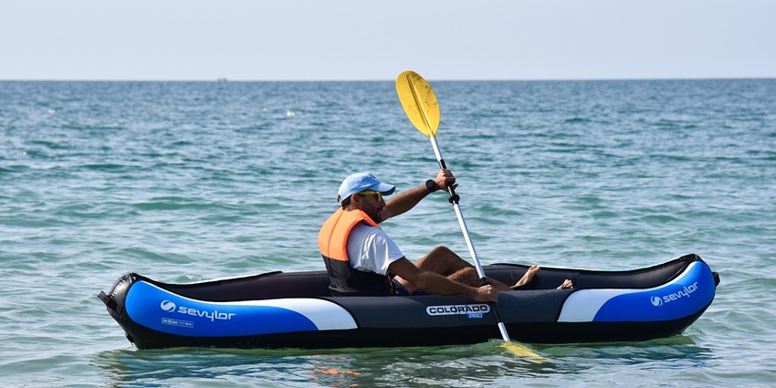 An image of a kayaker paddling in Acadia National Park, one of the best kayaking places in the USA.