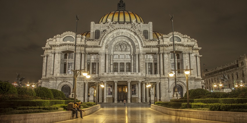 A nighttime view of a less crowded, grand Palacio de Bellas Artes in Mexico City, Mexico.