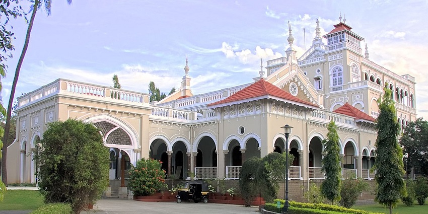 Image of Aga khan Palace with stunning architecture and ush green garden in front