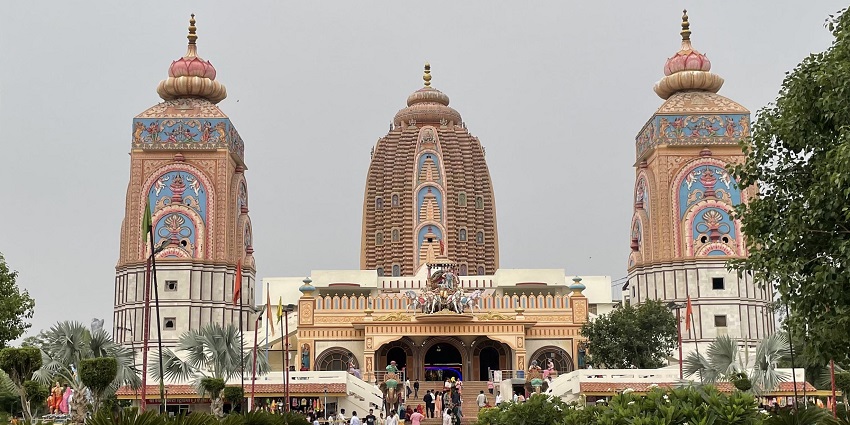 Three vibrantly and ornately decorated towers at Agroha Dham Temple in Haryana