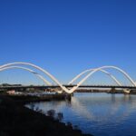 A view of Frederick Douglass Memorial Bridge in Washington, D.C., at sunset with a clear sky