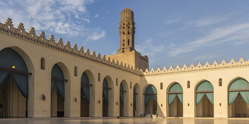 Inner view of the mosque surrounded by the buildings showcasing its pristine hall.