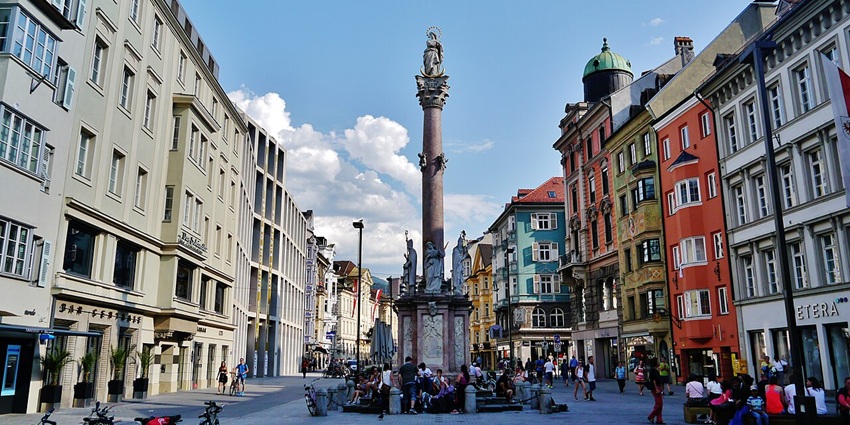 View of the Old Town of Innsbruck at twilight—historic streets framed by Tyrolean rooftops.