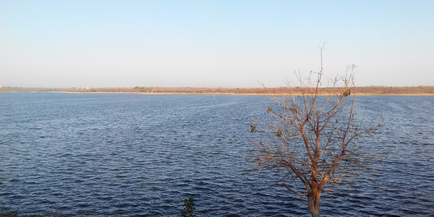 Serene view of the Ambazari Lake with a scenic backdrop.