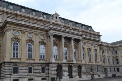 A picture of the interior view of an art gallery Budapest showcasing beautiful paintings.