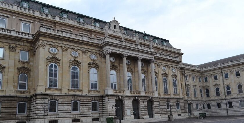 A picture of the interior view of an art gallery Budapest showcasing beautiful paintings.