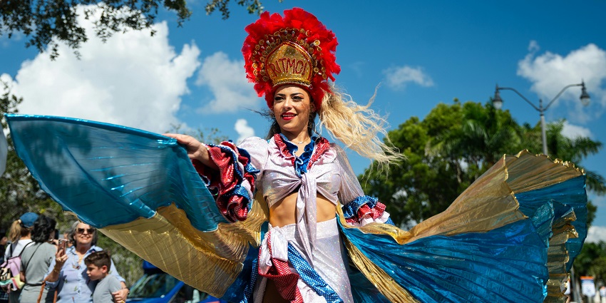 Image of Colorful Performer Dancing in Miami Carnival Parade - Harvest Festivals Miami