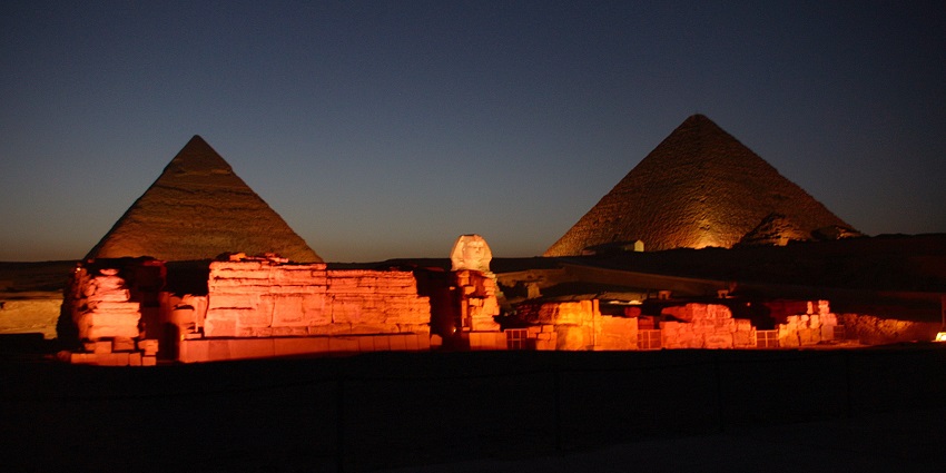 A beautifully illuminated Giza Pyramid Complex, one of the best things to do in Cairo in December.