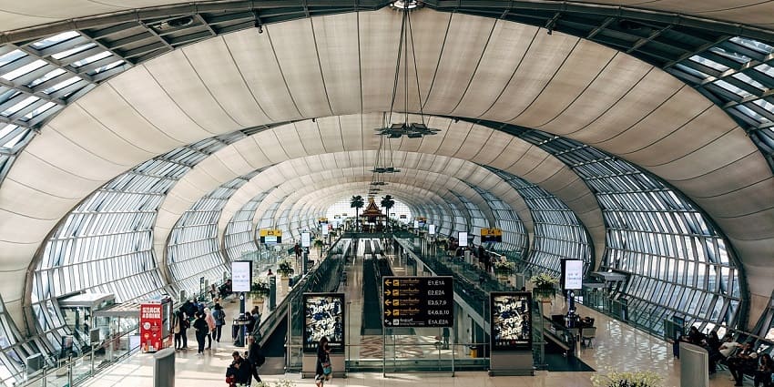 A vibrant view of a busy airport hall with travellers, a popular airport in Chicago.