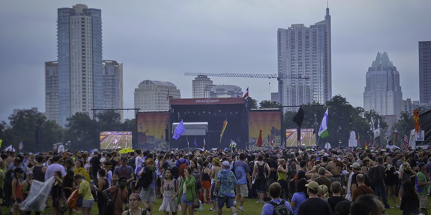 An image of a large crowd enjoying diverse performances at Austin City Limits Festival in Zilker Park