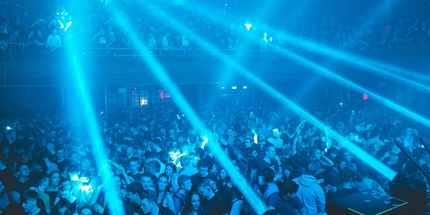 An image of people dancing and enjoying the vibrant atmosphere in a club