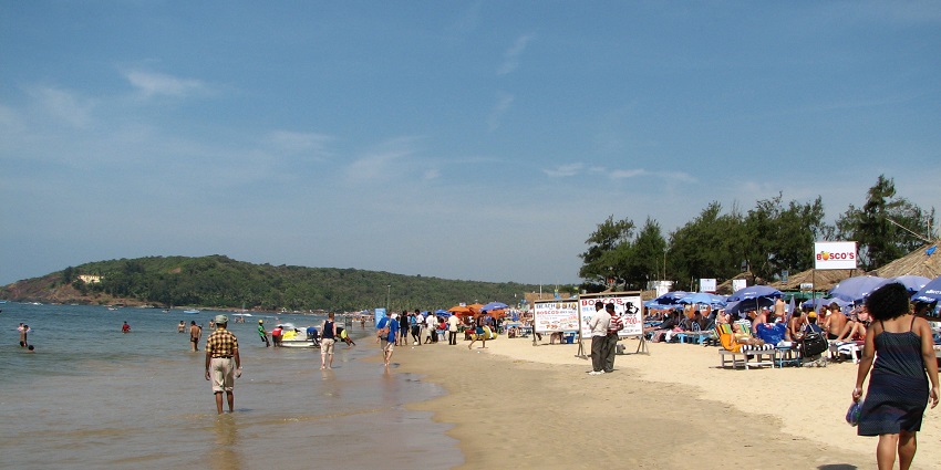 Beach chairs and beach boats at Baga Beach, a top tourist attraction.