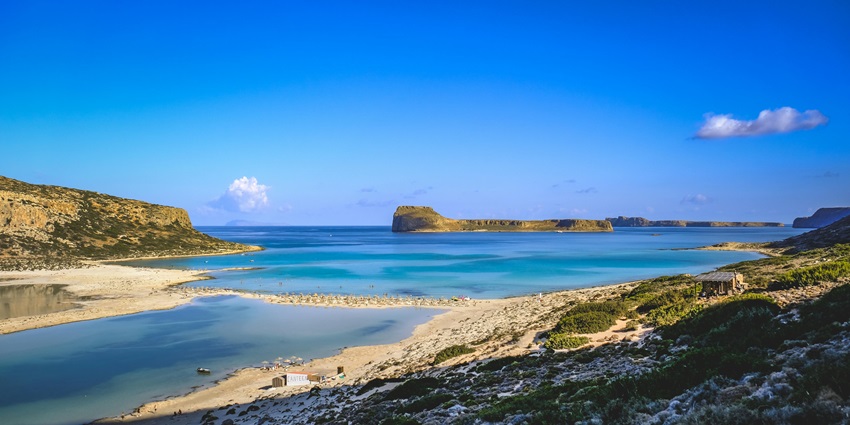 View of Balos Beach with rugged sand and turquoise water.
