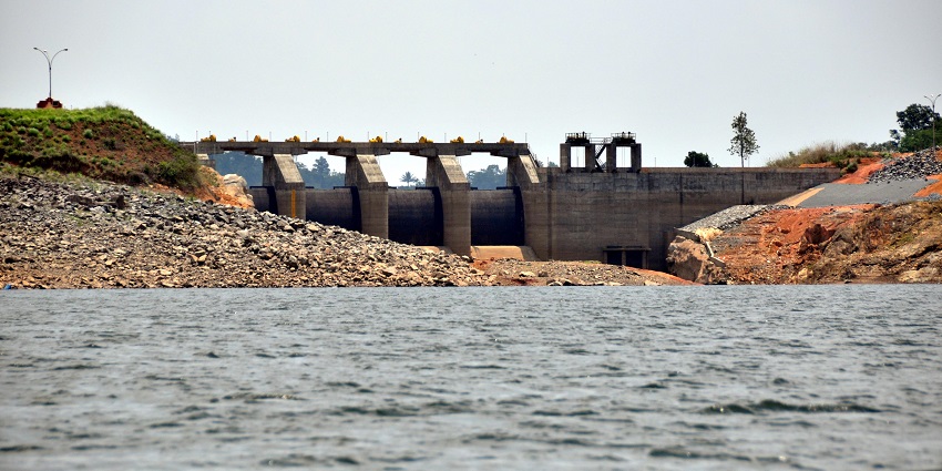 Earthen dam, surrounded by picturesque landscapes, featured in Wayanad travel guide.