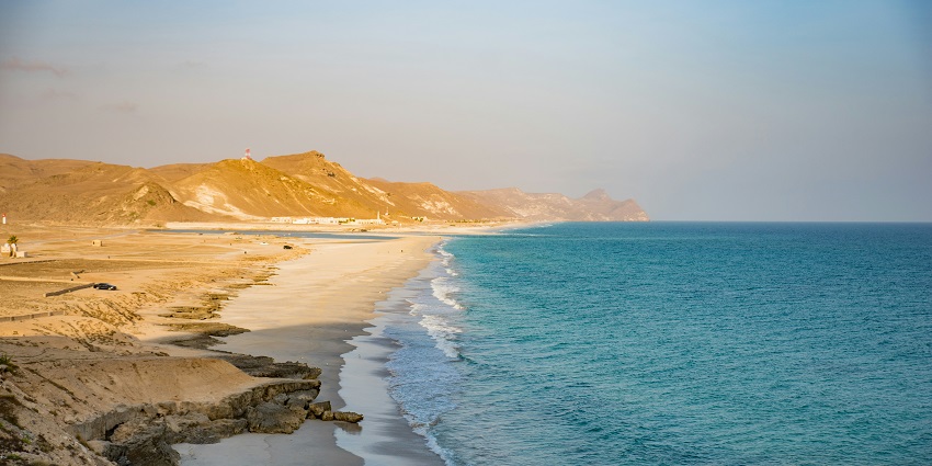 Bandar Al Khairan Beach one of the Oman beaches with clear waters and rocky landscapes.