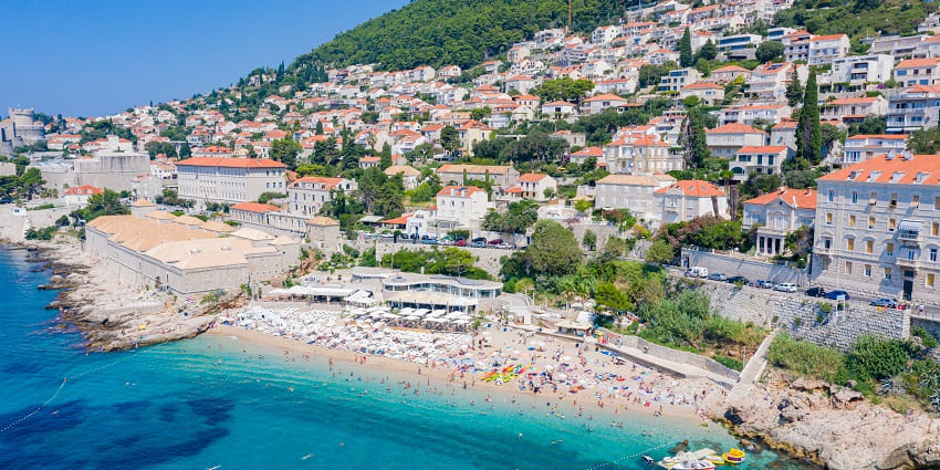 A picture of Banje Beach, offering a stunning view of the city walls.