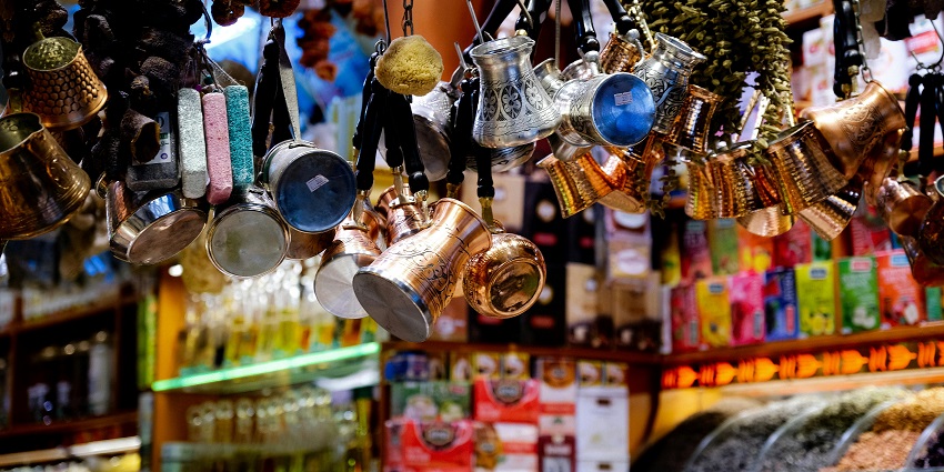 Image of a shop hanging colourful items and other pooja things to buy